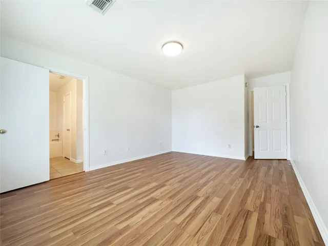 a bathroom with a double vanity sink mirror and toilet
