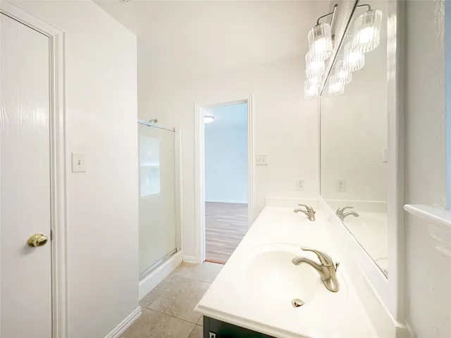 a view of an empty room and wooden floor