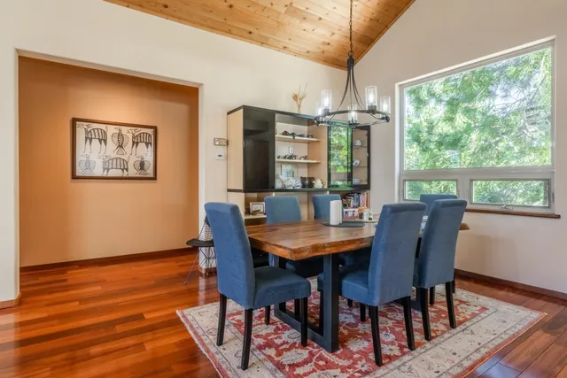 a view of a dining room with furniture window and wooden floor