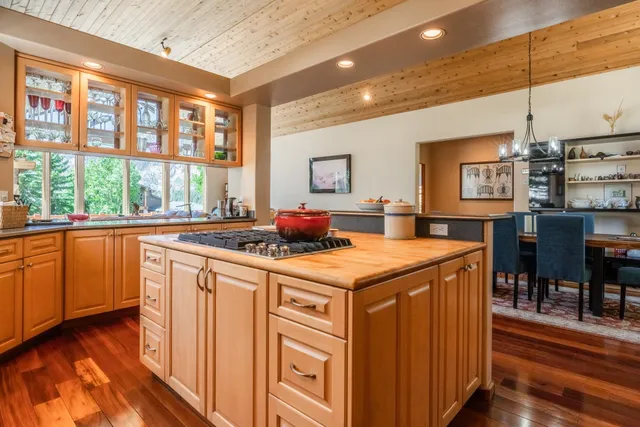 a kitchen with a stove a sink and a refrigerator