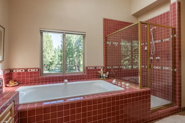 a bathroom with a bathtub and window