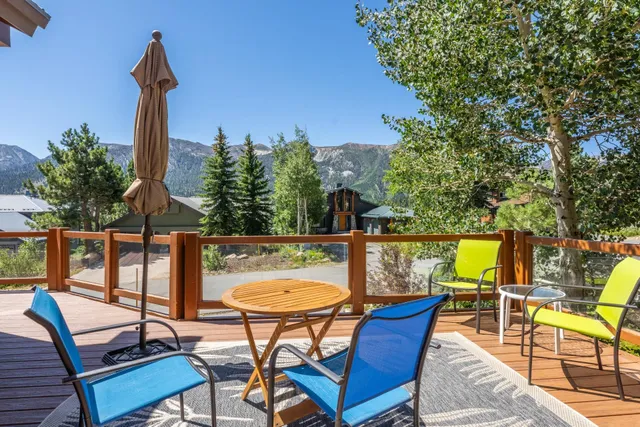 a view of a chairs and table in patio