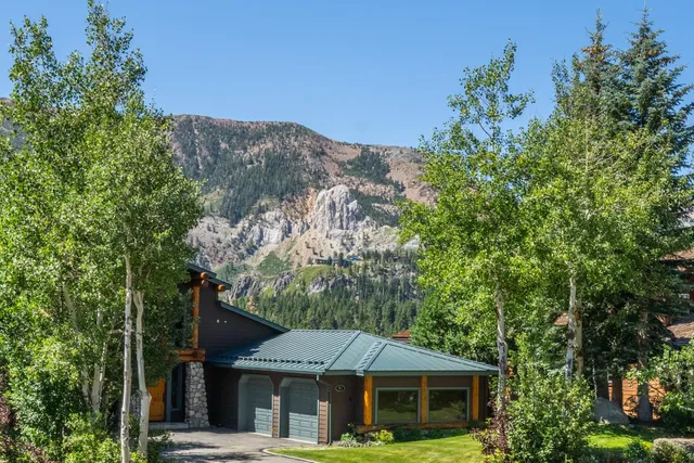 front view of a house with a tree