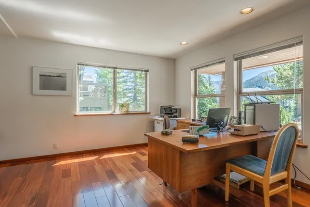 a room with a wooden floor and furniture