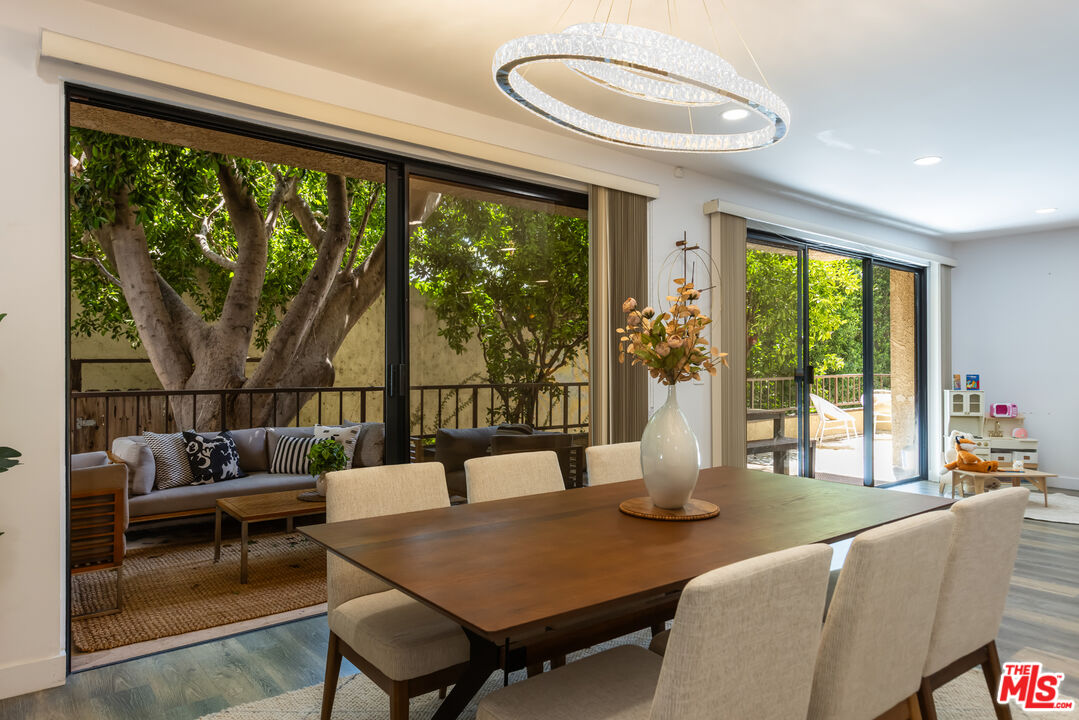 1210 North Kings Road, Unit 101 West Hollywood, CA 90069 - Photo 12 of 32 a living room with furniture and a large window
