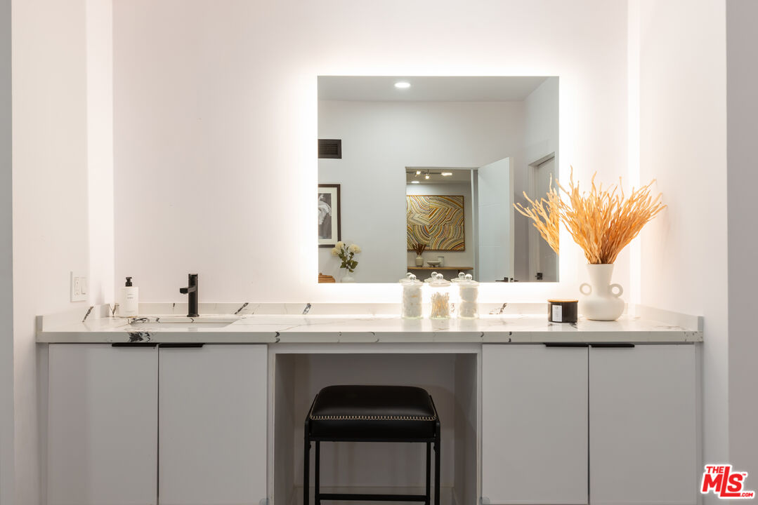 1210 North Kings Road, Unit 101 West Hollywood, CA 90069 - Photo 20 of 32 a bathroom with a sink and a mirror