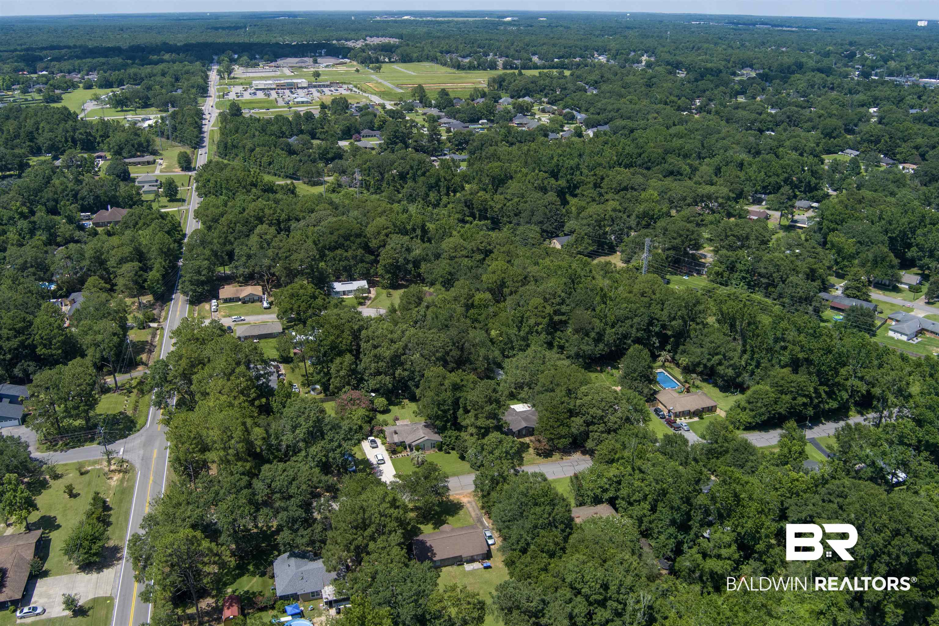 0 McFarland Road Mobile, AL 36695 - Photo 8 of 11 Aerial view of property and surrounding area with a forest