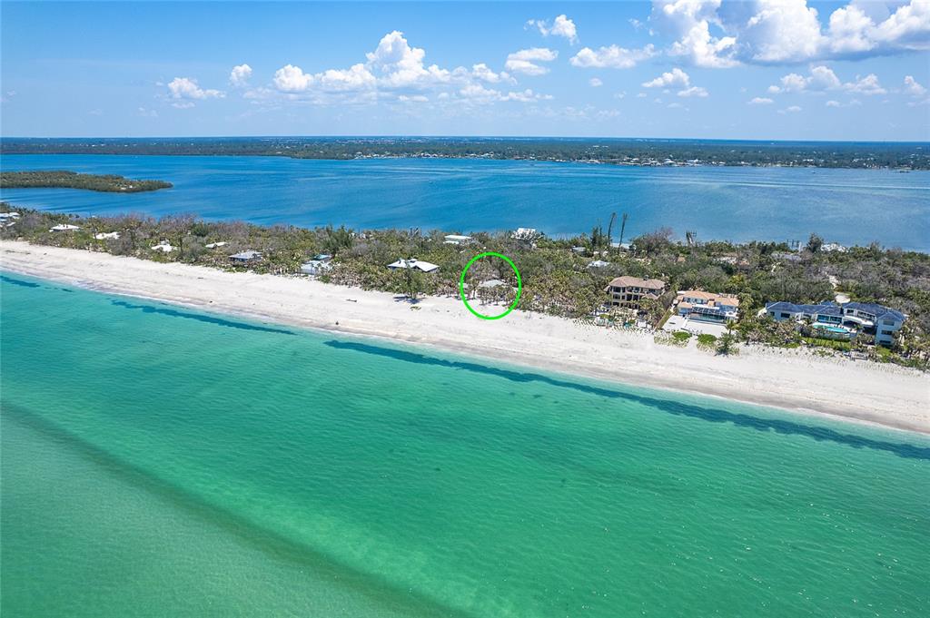 6400 Manasota Key Road Englewood, FL 34223 - Photo 6 of 10 a view of a lake with a yard