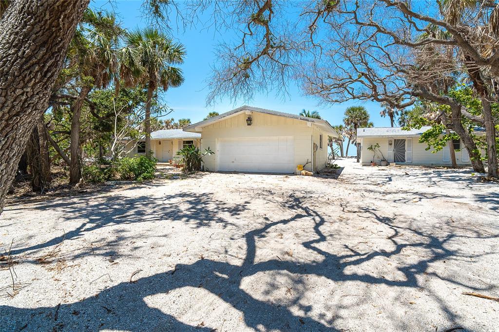 6400 Manasota Key Road Englewood, FL 34223 - Photo 10 of 10 a view of a chairs and table in backyard