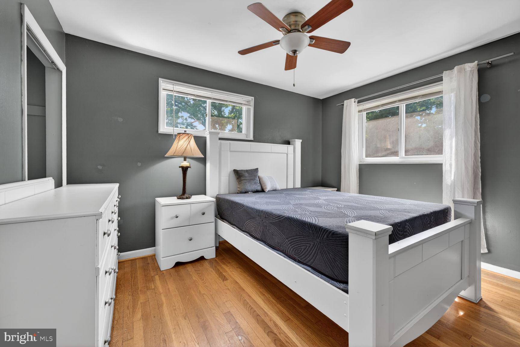 1104 Caddington Avenue Silver Spring, MD 20901 - Photo 18 of 35 a bedroom with a bed and a chandelier