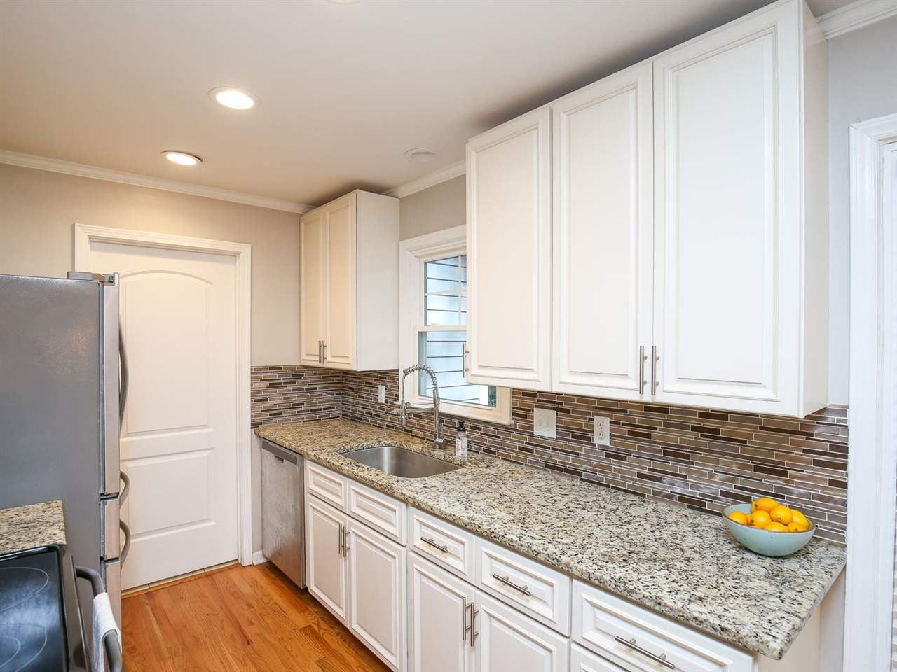 4012 Cardigan Place Raleigh, NC 27609 - Photo 10 of 30 Updated kitchen w/window over the sink and two pantries!