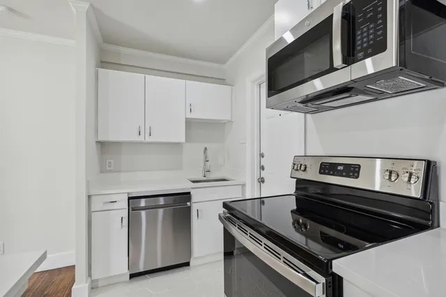 a kitchen with a stove and a microwave
