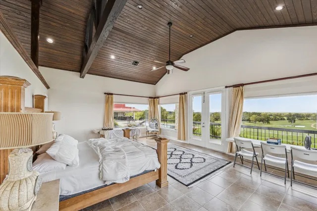 a spacious bathroom with a double vanity sink a mirror and a shower