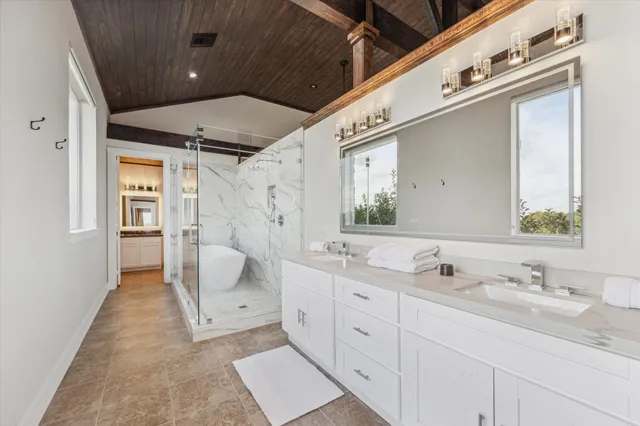 a living room with furniture rug and a flat screen tv