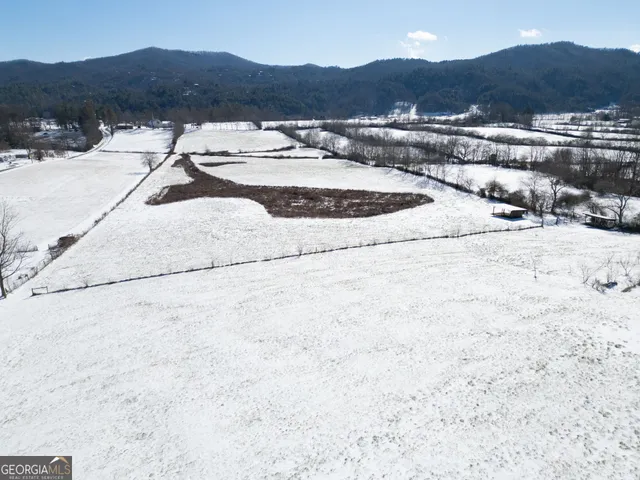 a view of a yard with a snow