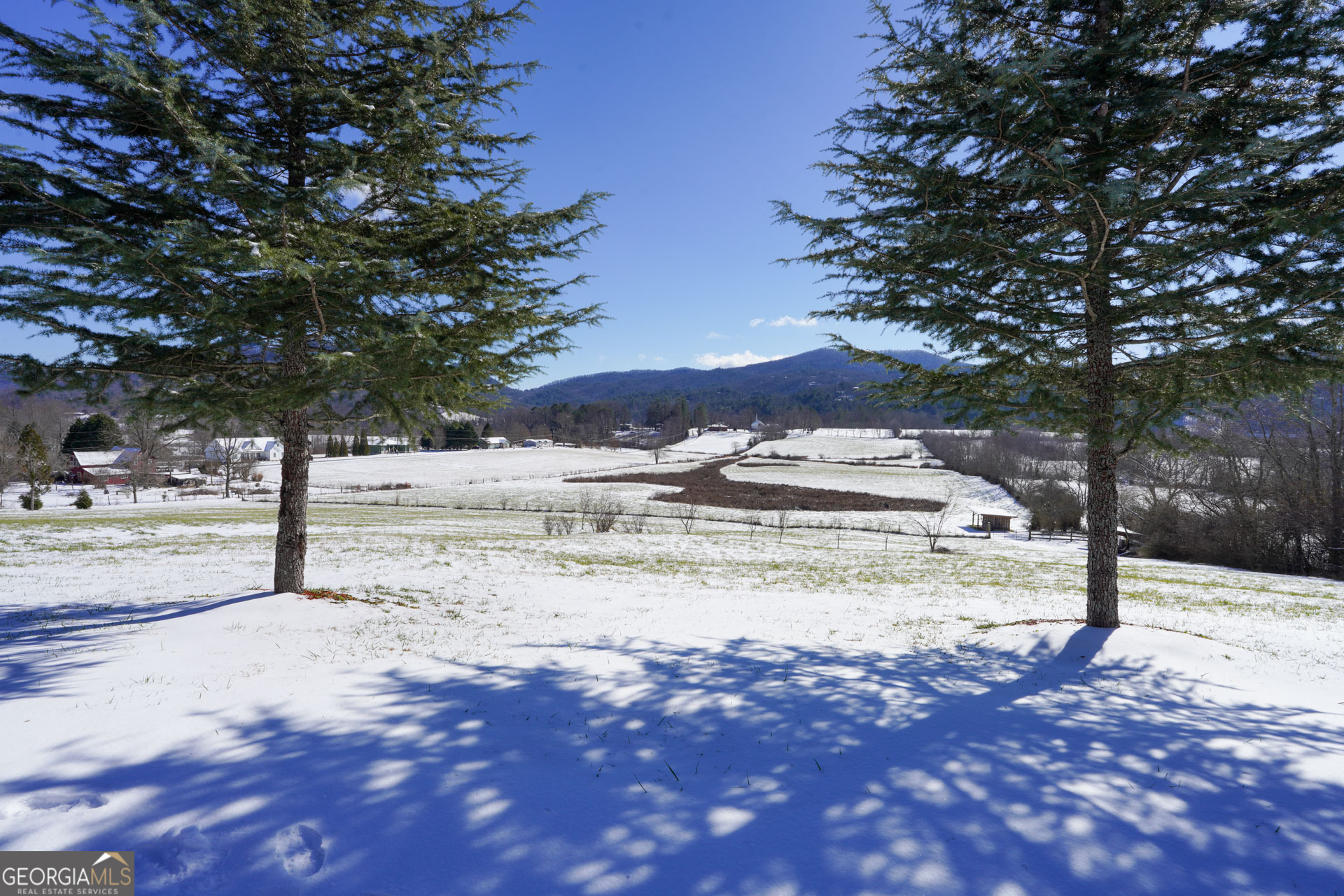 5192 Wolffork Road Rabun Gap, GA 30568 - Photo 15 of 63 a view of a yard covered with snow