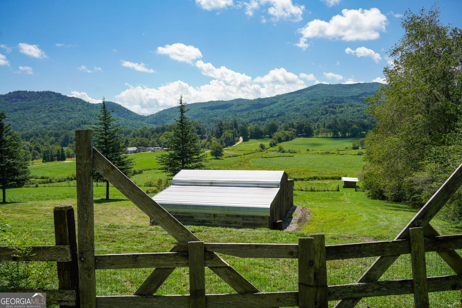 5192 Wolffork Road Rabun Gap, GA 30568 - Photo 20 of 63 a view of a two chairs in a big yard