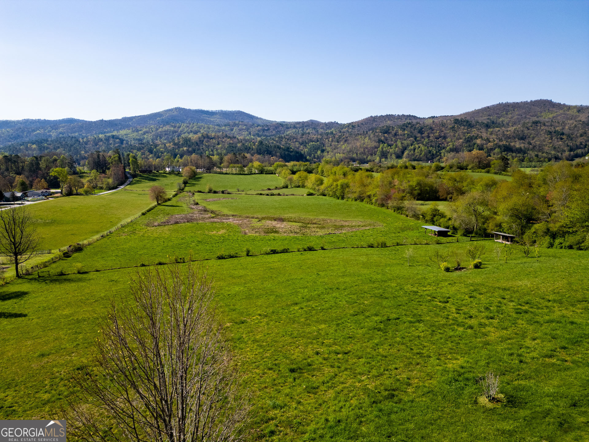 5192 Wolffork Road Rabun Gap, GA 30568 - Photo 29 of 63 a view of a lush green hillside and houses