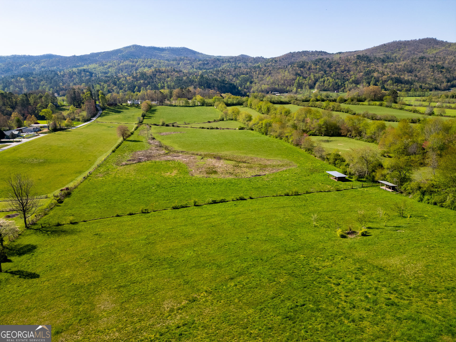 5192 Wolffork Road Rabun Gap, GA 30568 - Photo 30 of 63 a view of a lush green hillside and houses