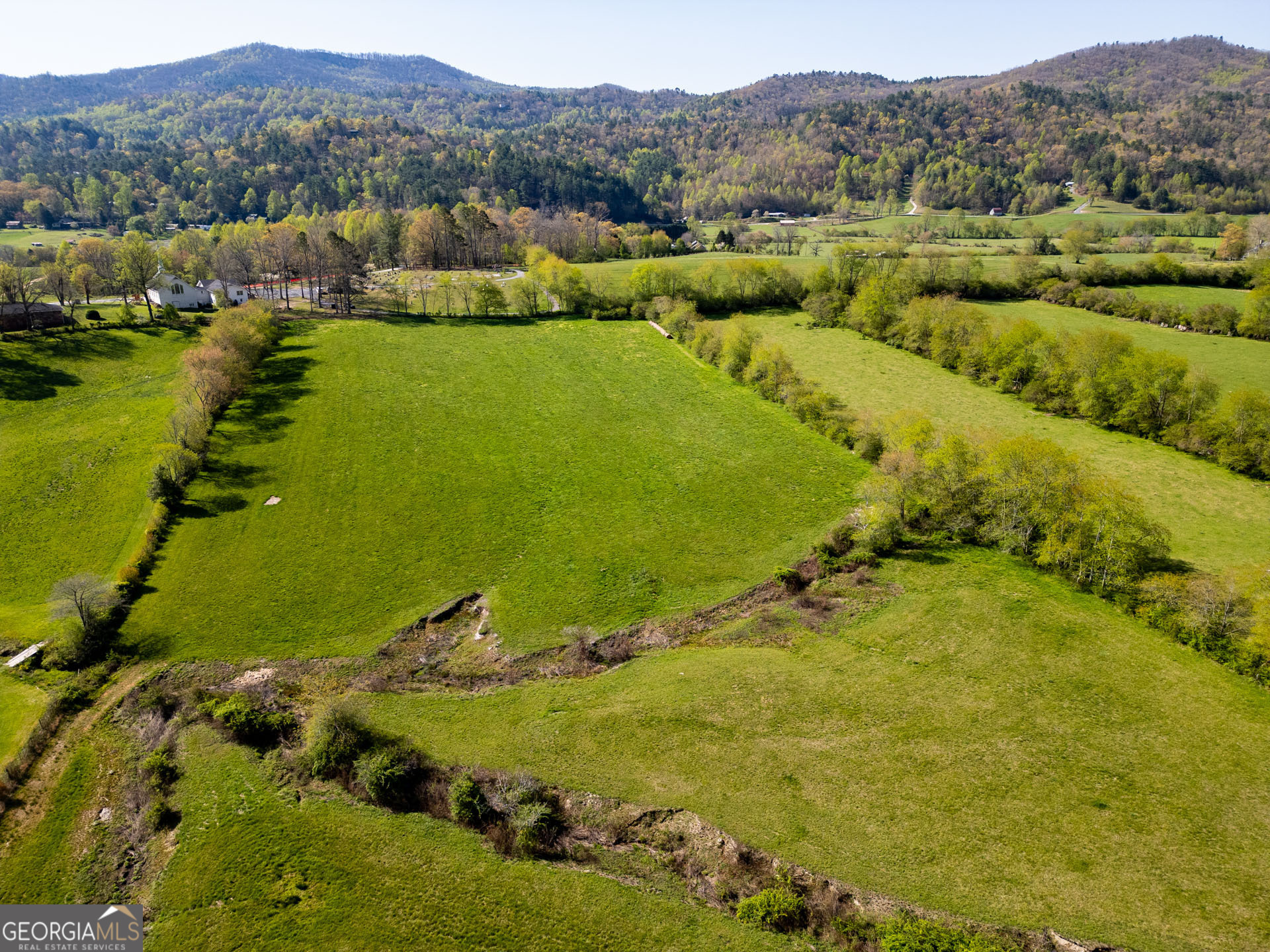 5192 Wolffork Road Rabun Gap, GA 30568 - Photo 37 of 63 a view of an ocean with mountains in the background