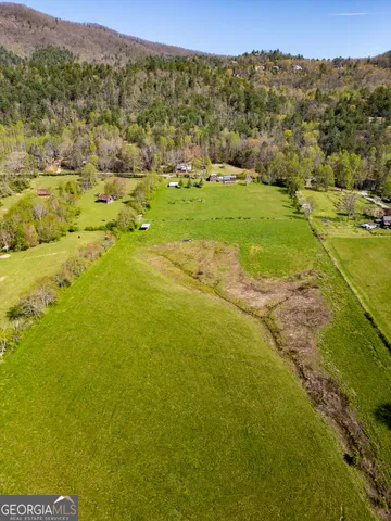 a view of empty room with wooden walls
