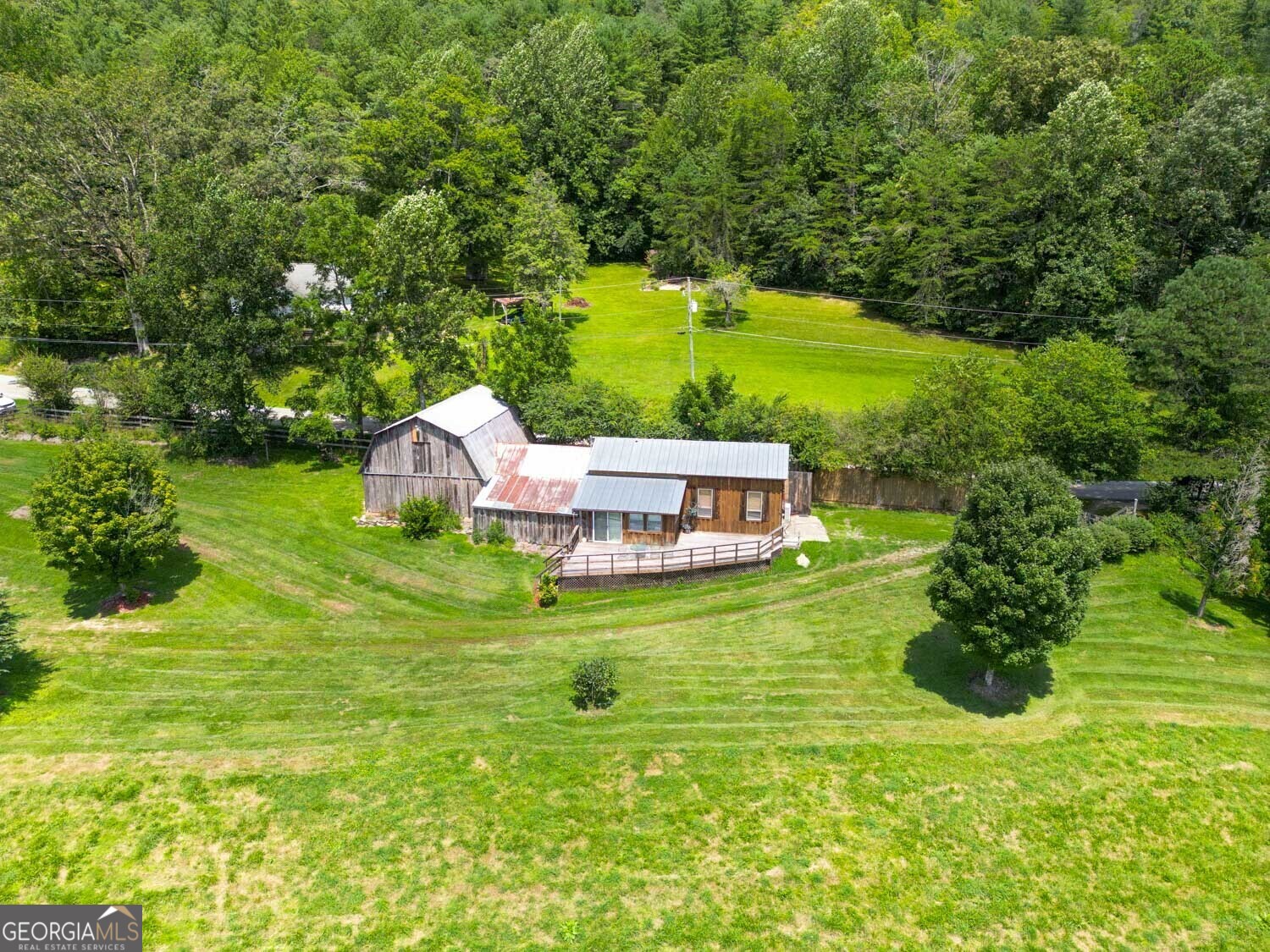 5192 Wolffork Road Rabun Gap, GA 30568 - Photo 52 of 63 a aerial view of a house with a big yard