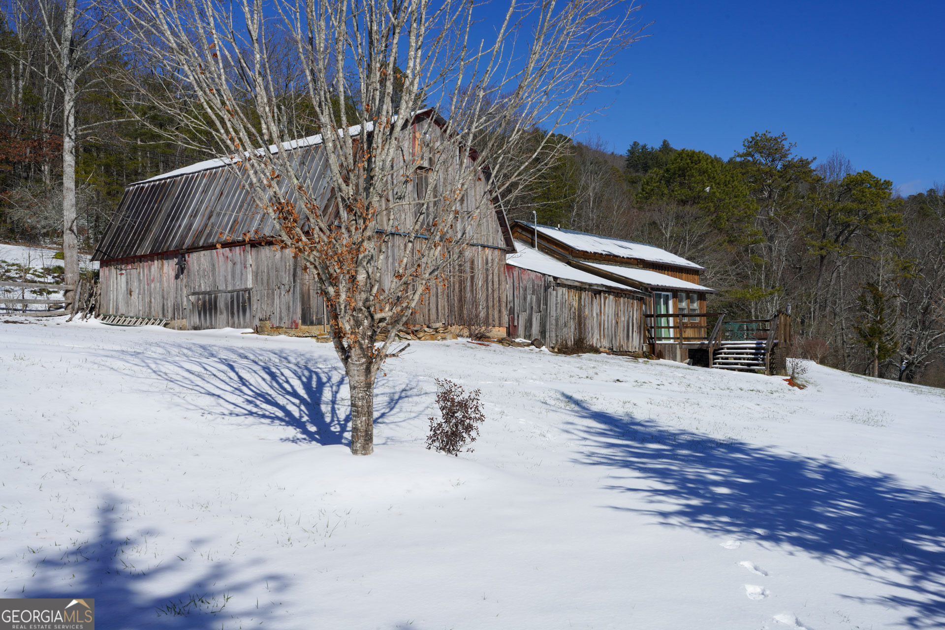 5192 Wolffork Road Rabun Gap, GA 30568 - Photo 6 of 63 a view of a house with a snow in the yard