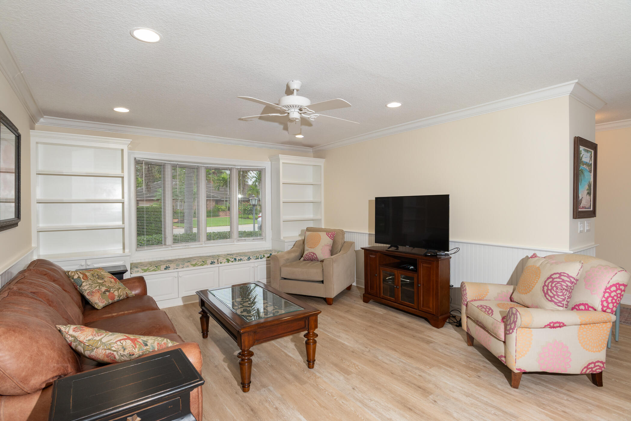 2918 Southeast Fairway West, Unit 13 Stuart, FL 34997 - Photo 14 of 35 a living room with furniture and a flat screen tv