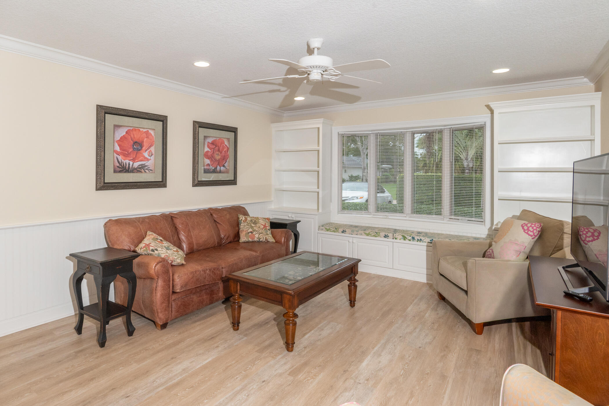 2918 Southeast Fairway West, Unit 13 Stuart, FL 34997 - Photo 15 of 35 a living room with furniture and a large window