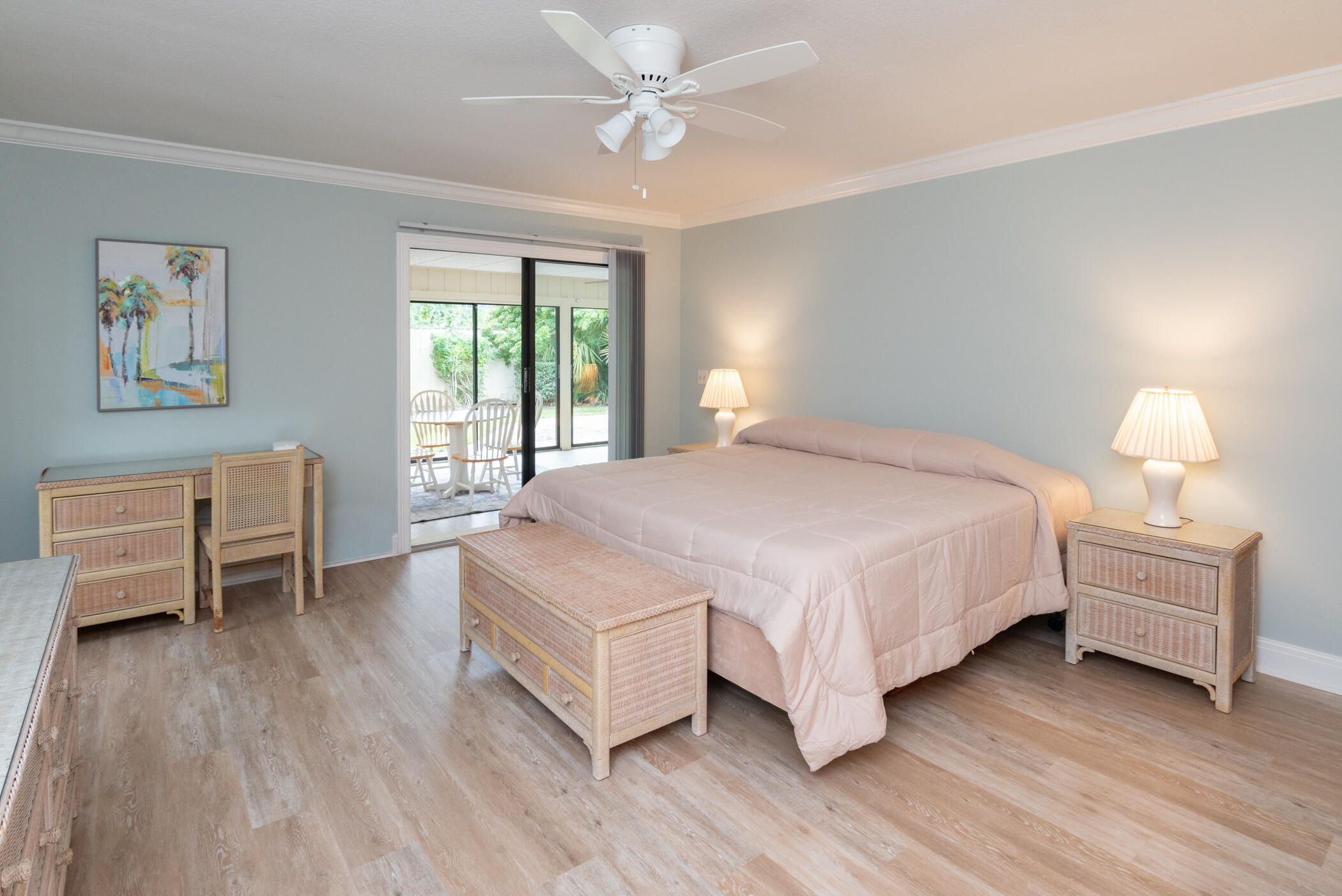 2918 Southeast Fairway West, Unit 13 Stuart, FL 34997 - Photo 21 of 35 a bedroom with a bed and a chair