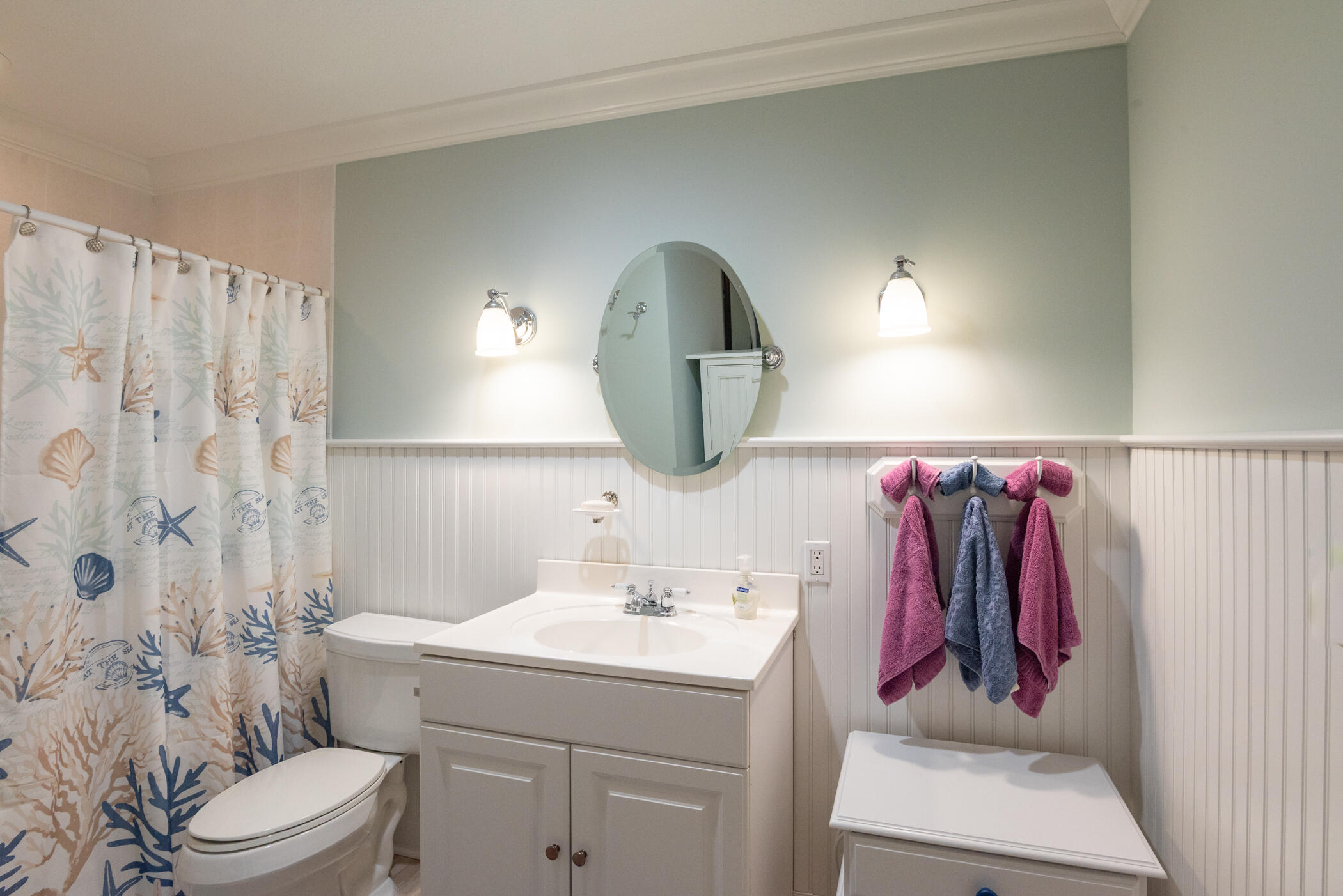 2918 Southeast Fairway West, Unit 13 Stuart, FL 34997 - Photo 24 of 35 a bathroom with a sink vanity mirror and toilet