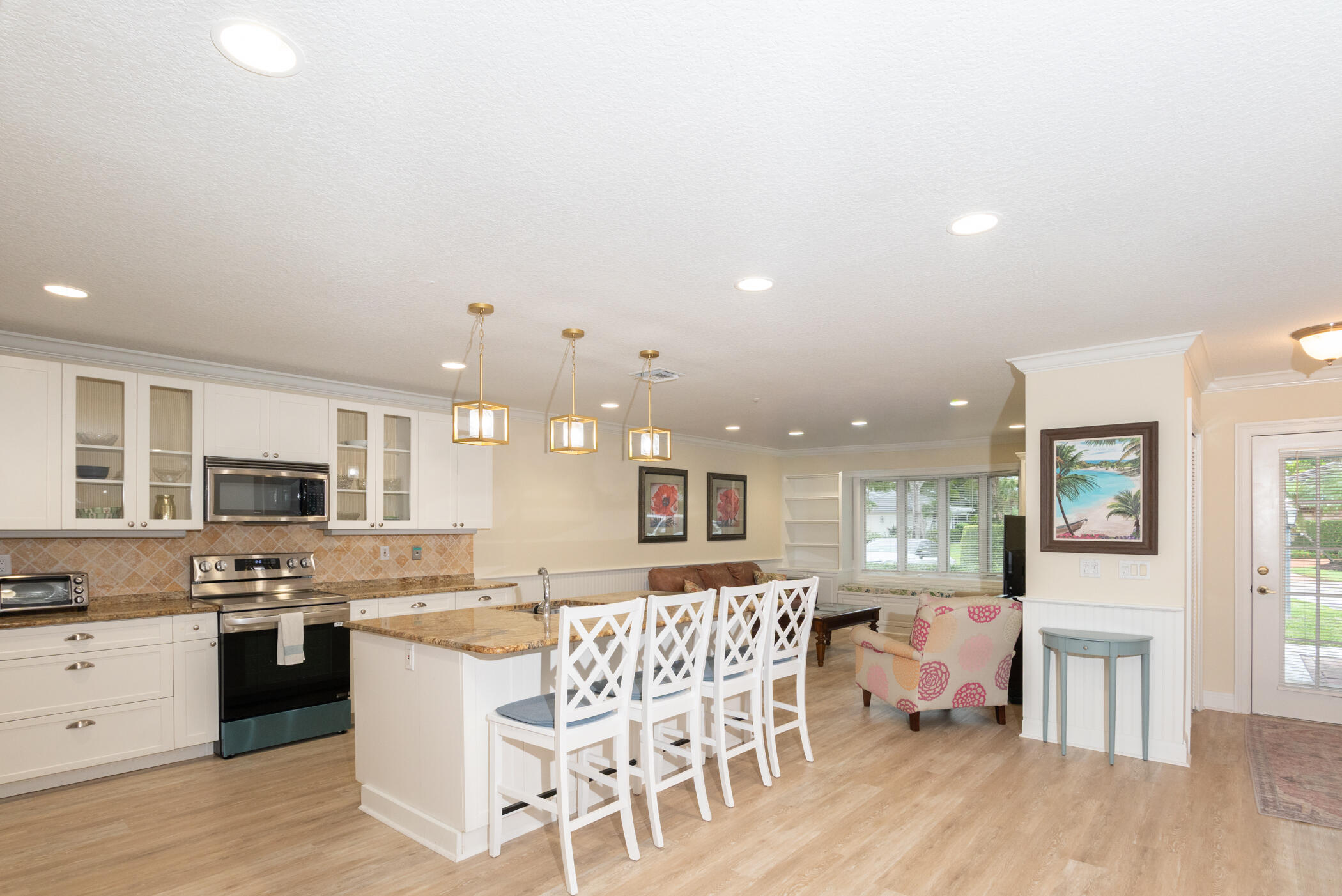 2918 Southeast Fairway West, Unit 13 Stuart, FL 34997 - Photo 7 of 35 a kitchen with a table and chairs in it