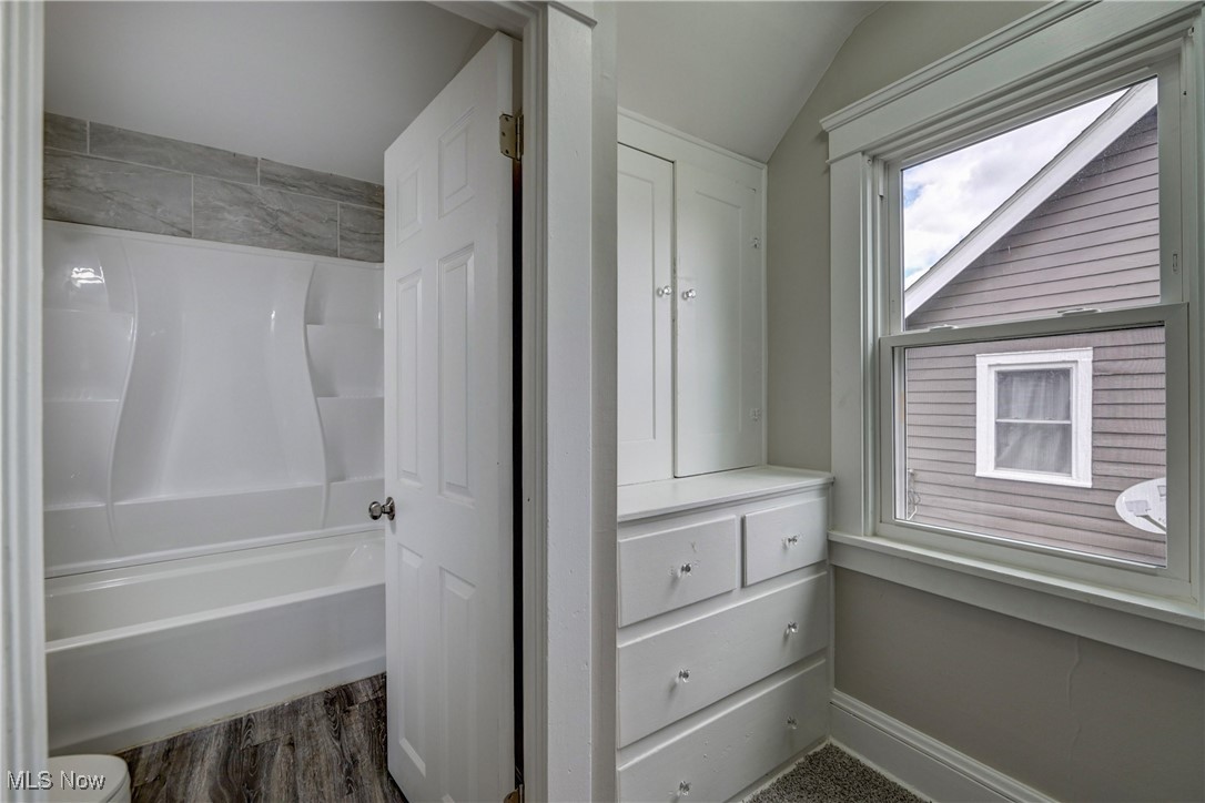 896 Selwyn Road Cleveland Heights, OH 44112 - Photo 11 of 23 Full bath featuring vaulted ceiling, shower / bathtub combination, and wood finished floors