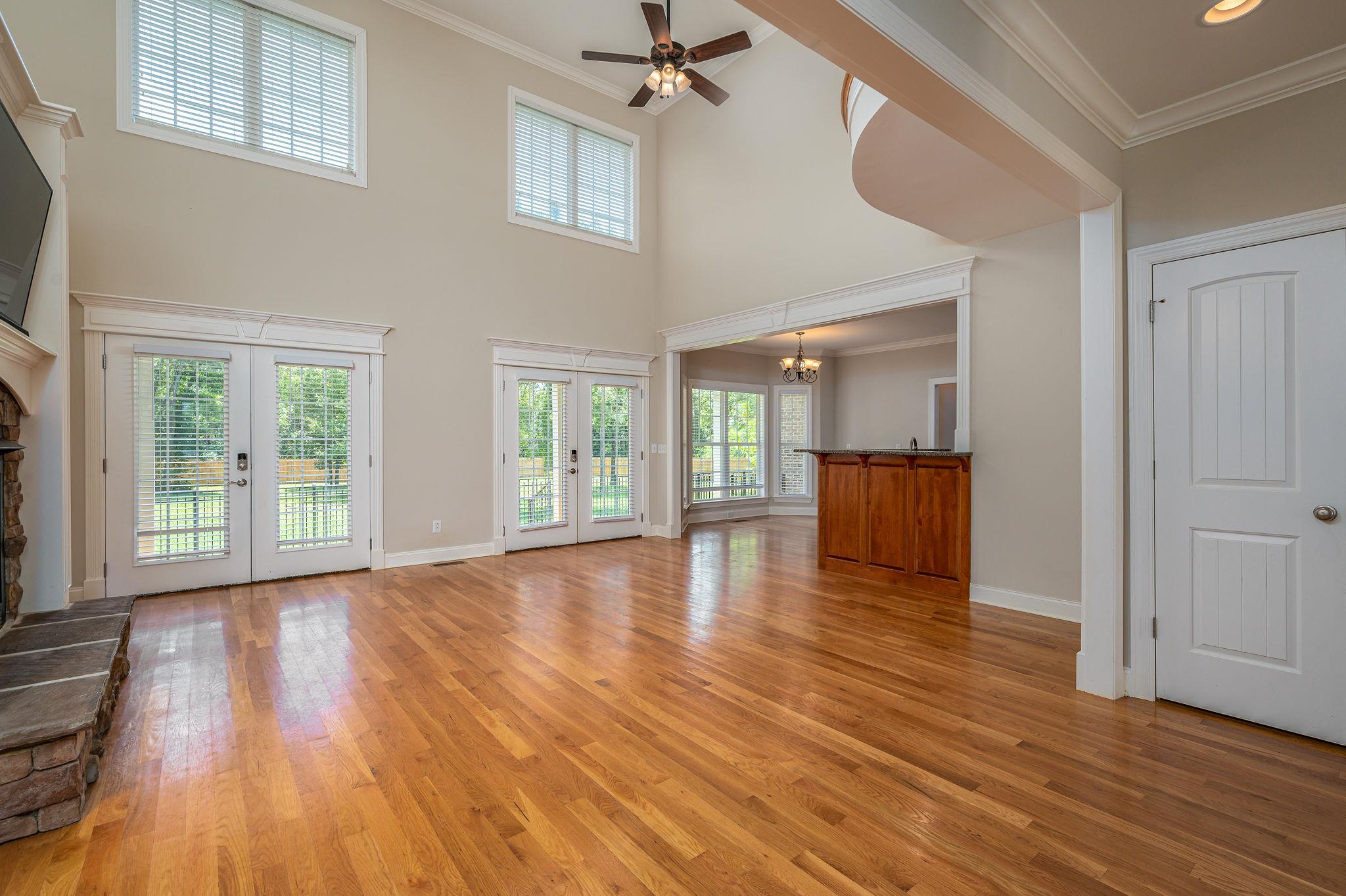 8460 East Gum Road Murfreesboro, TN 37127 - Photo 9 of 30 Amazing Floors & Windows in this 2-story Den! French Doors open to the Patio & Private Backyard!