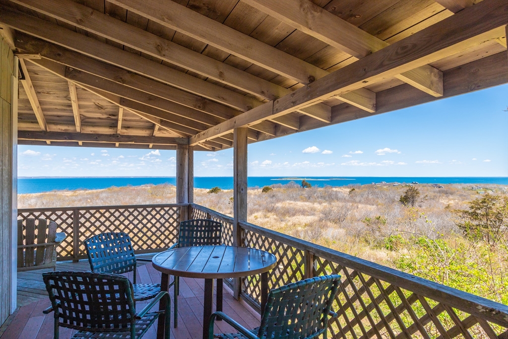0 Bayberry Hill Road Cuttyhunk, MA 02713 - Photo 9 of 12 a city view from a balcony with furniture
