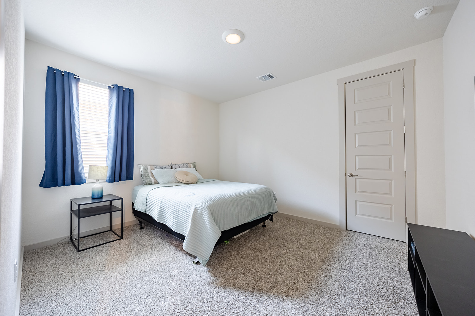 900 Balsora Cove Georgetown, TX 78628 - Photo 18 of 39 A well-lit bedroom provides comfort with soft carpeting and ample space for relaxation.