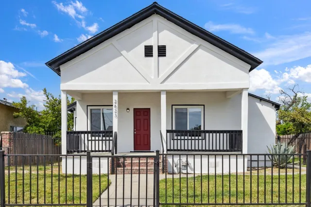 a front view of a house with a porch