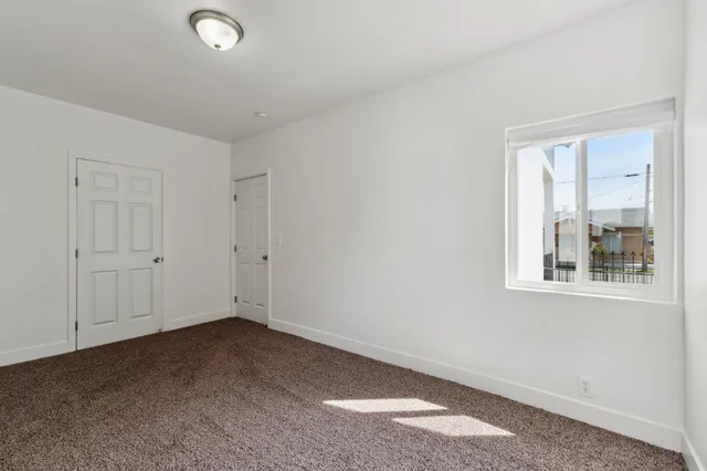 a bathroom with a double vanity sink and mirror