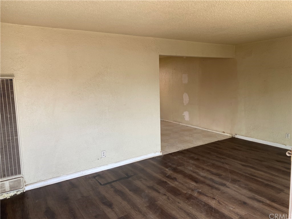 823 East 75th Street Los Angeles, CA 90001 - Photo 12 of 13 an empty room with wooden floor