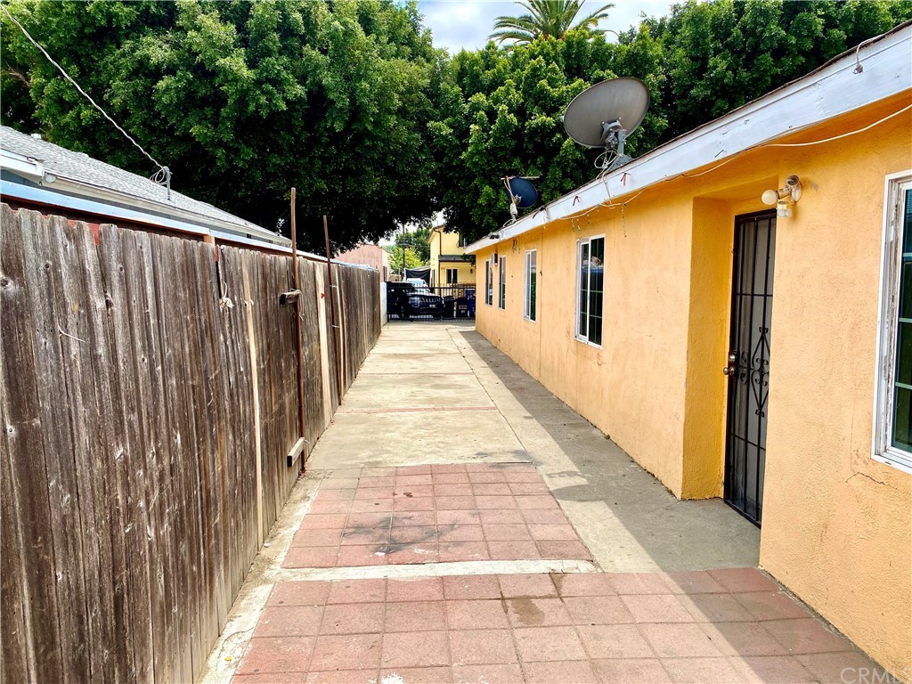 823 East 75th Street Los Angeles, CA 90001 - Photo 6 of 13 a view of a balcony with wooden floor