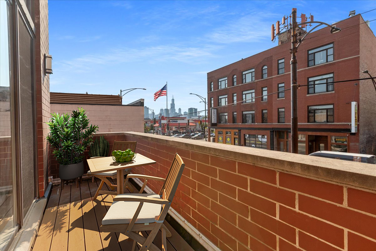 1610 West Grand Avenue, Unit 2C Chicago, IL 60622 - Photo 11 of 13 a view of a chairs and table in a balcony