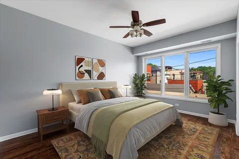 a bed room with a bed and a chandelier