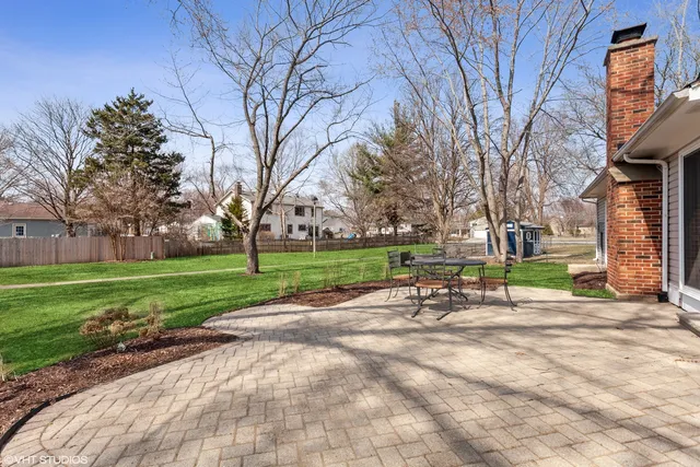 a view of a park with bench and trees