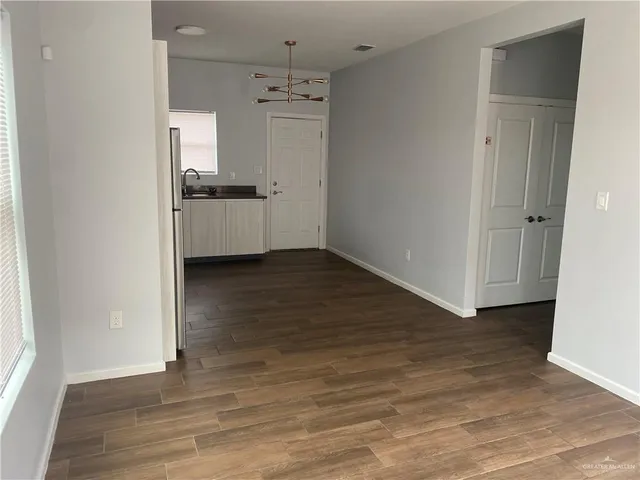 a kitchen with a refrigerator stove and sink