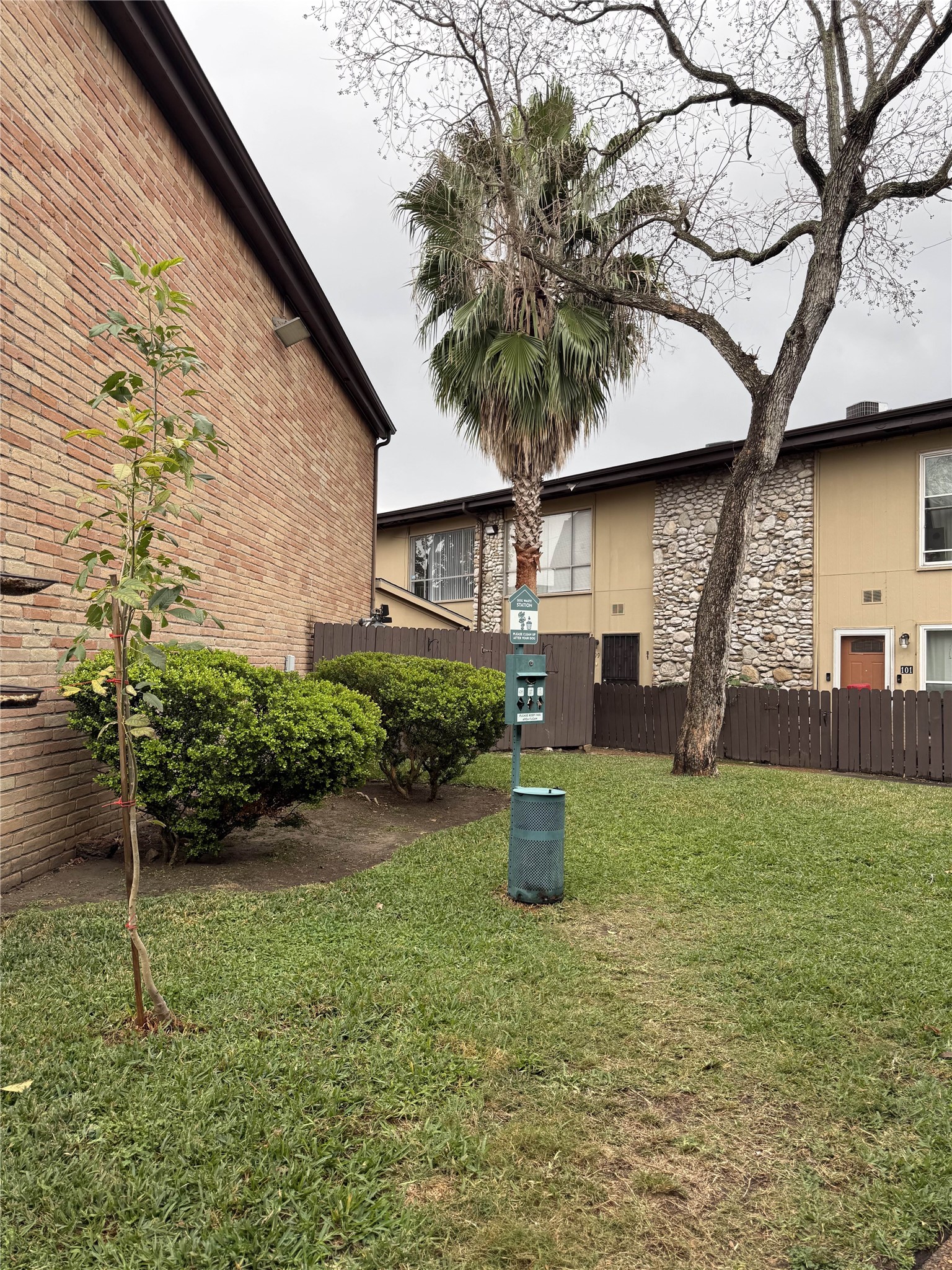 7047 Bissonnet Street, Unit 70 Houston, TX 77074 - Photo 5 of 23 a house view with a garden space