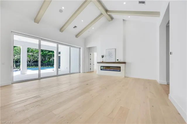 a big room with closet and windows