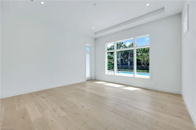 a bathroom with a tub sink shower and mirror