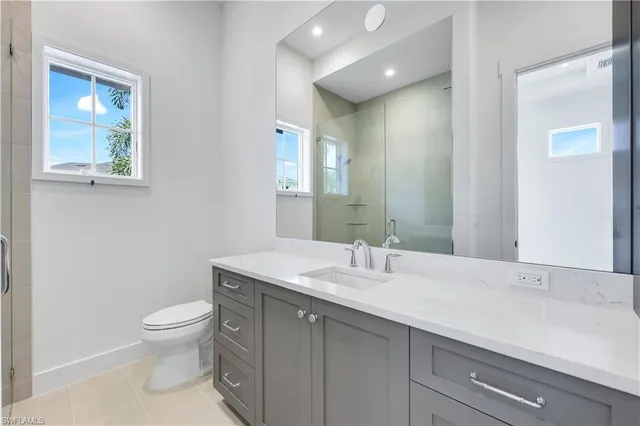 a bathroom with a toilet sink and shower