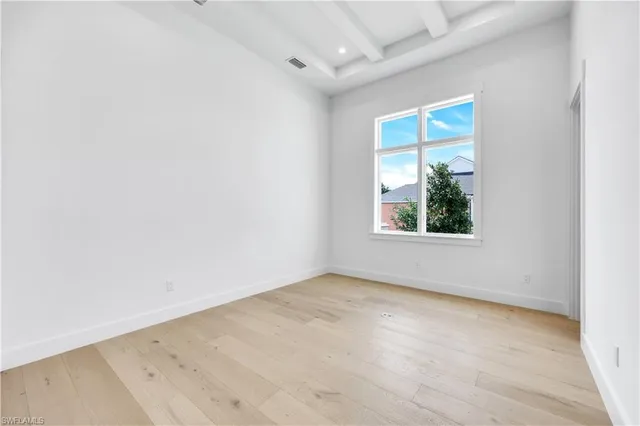 a view of a kitchen with a sink and a large window