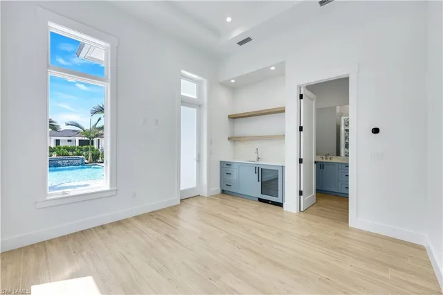 a utility room with sink dryer and washer
